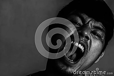 Close-up image of angry manâ€™s face Stock Photo